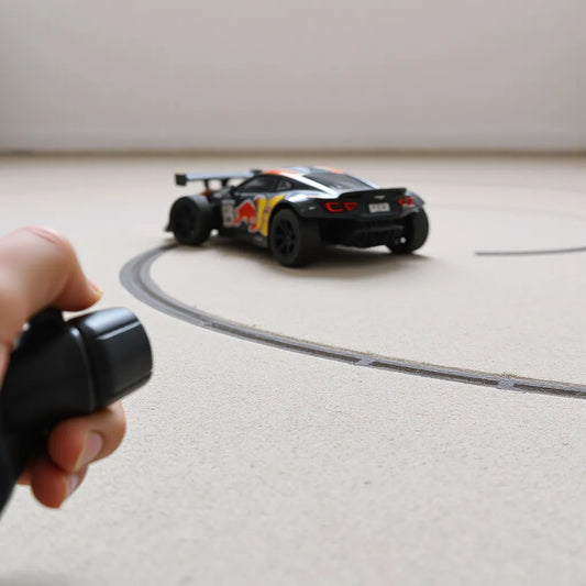 Drift-ready RC car on a track corner with angled rear tires and visible traction