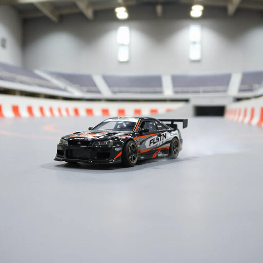 RC drift car angled mid-slide with visible tire smoke on a smooth track